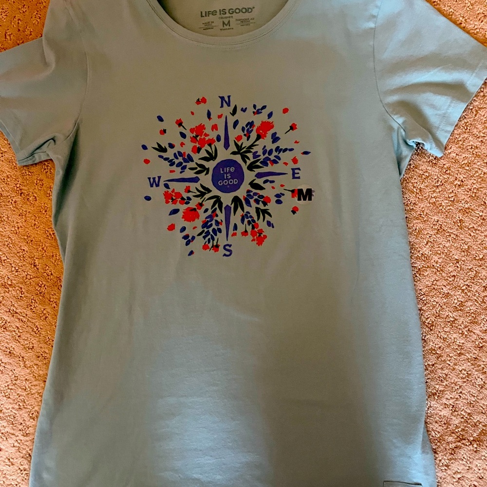 Life is Good; size Medium, short sleeve tee shirt with floral dial on front.